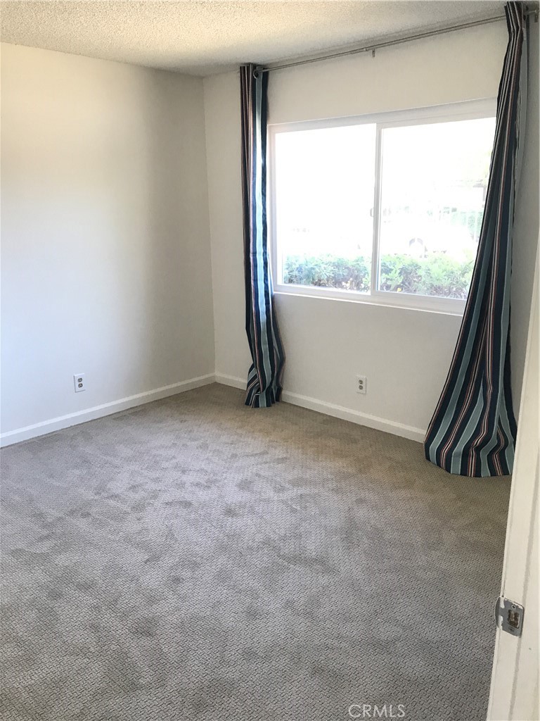 454 East Ave Q3, Unit 5 Palmdale, CA 93550 - Photo 8 of 10 an empty room with a window