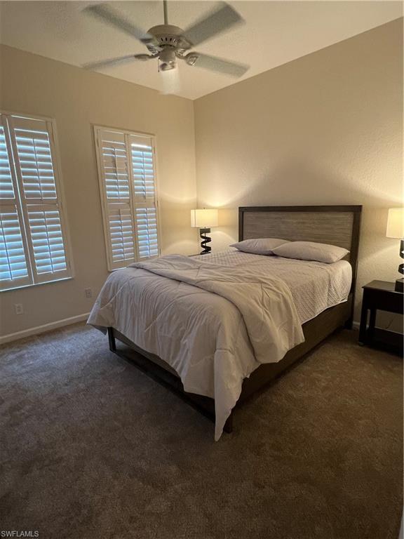 7896 Founders Circle Naples, FL 34104 - Photo 13 of 18 a bedroom with bed and window