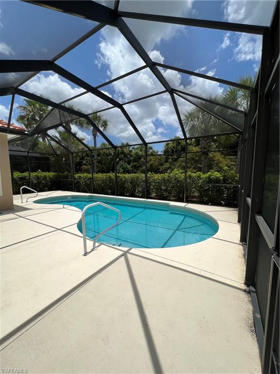 7896 Founders Circle Naples, FL 34104 - Photo 15 of 18 a view of swimming pool with a yard