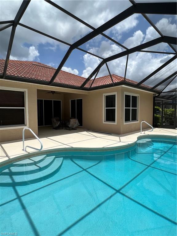 7896 Founders Circle Naples, FL 34104 - Photo 17 of 18 a house with swimming pool in front of it