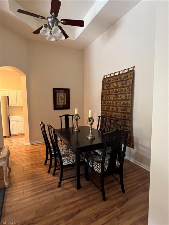 7896 Founders Circle Naples, FL 34104 - Photo 8 of 18 a view of a dining room with furniture and wooden floor