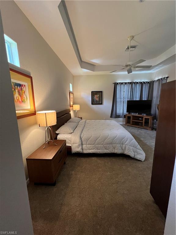 7896 Founders Circle Naples, FL 34104 - Photo 9 of 18 a bedroom with bed couch and window