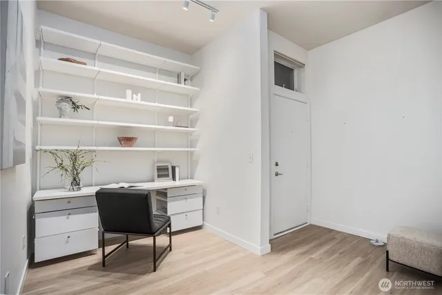 a workspace with furniture and wooden floor