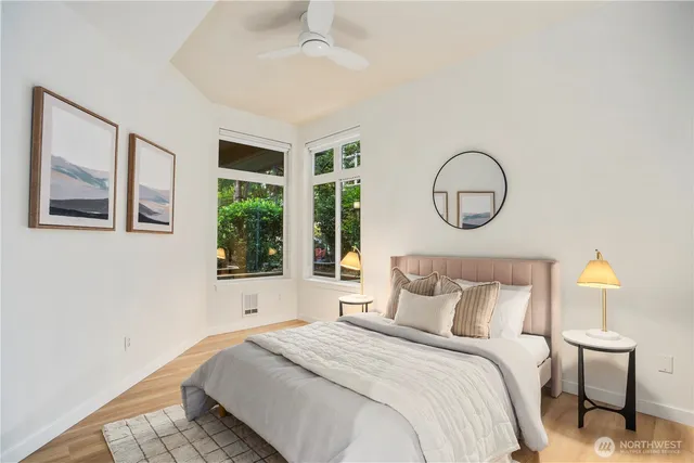 a bedroom with a large bed and a window