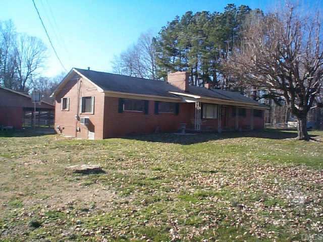 8898 Durham Road Timberlake, NC 27583 - Photo 1 of 10 a view of a house with a yard