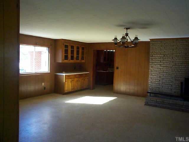 8898 Durham Road Timberlake, NC 27583 - Photo 3 of 10 a view of an empty room with a kitchen