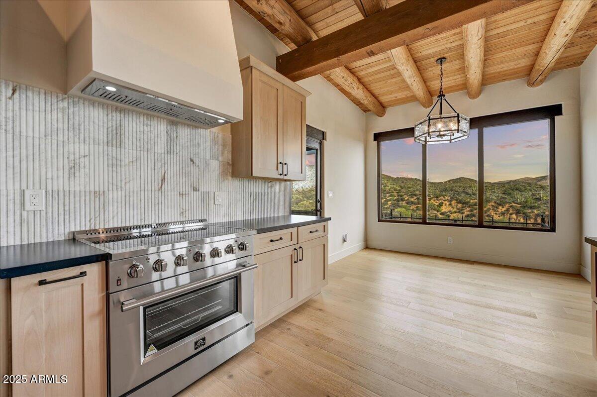 11702 East Blue Wash Road Scottsdale, AZ 85262 - Photo 20 of 50 a kitchen with a stove and a wooden floor