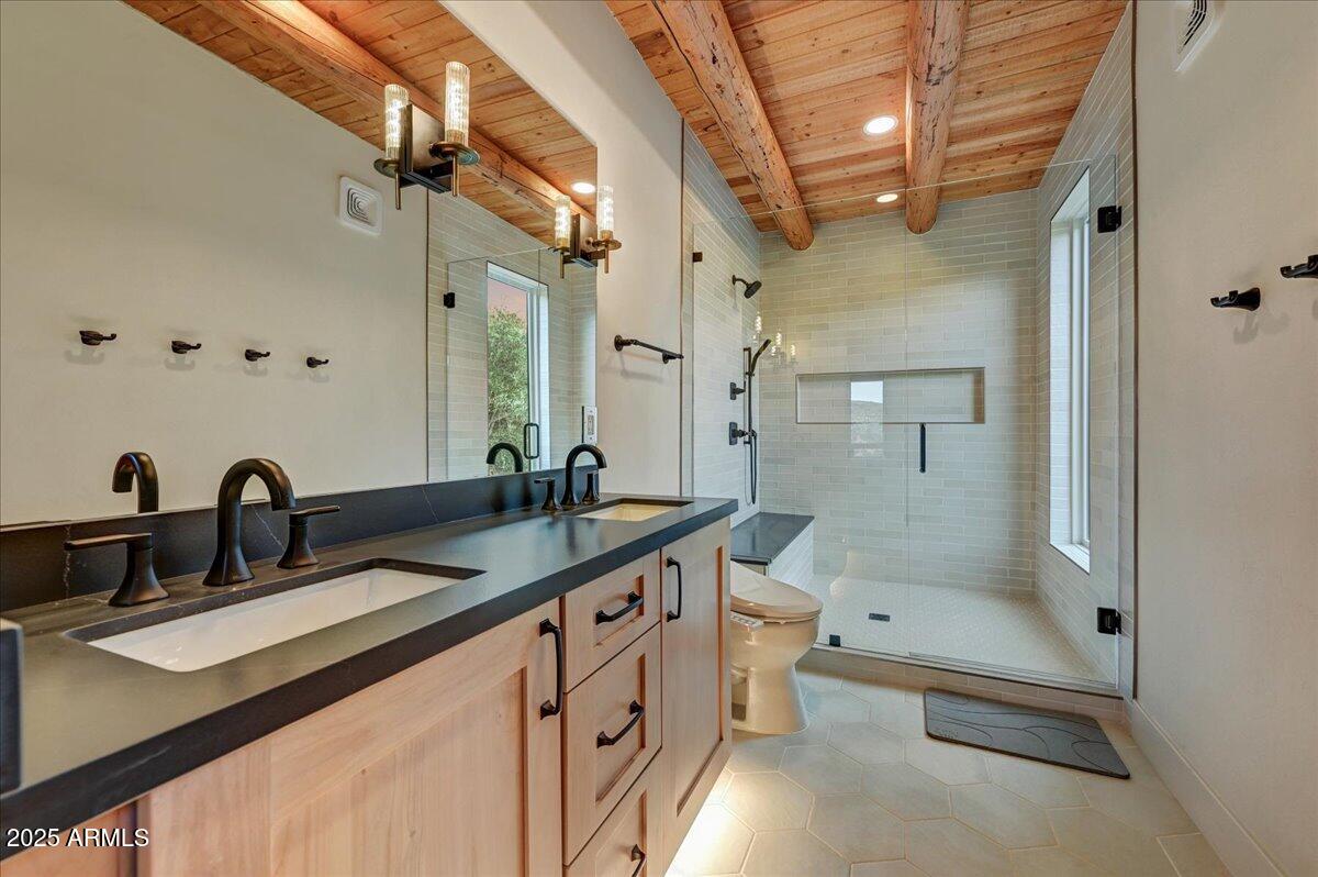 11702 East Blue Wash Road Scottsdale, AZ 85262 - Photo 27 of 50 a bathroom with a granite countertop sink mirror and bathtub