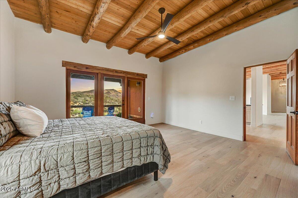 11702 East Blue Wash Road Scottsdale, AZ 85262 - Photo 30 of 50 a bedroom with a large bed and a window