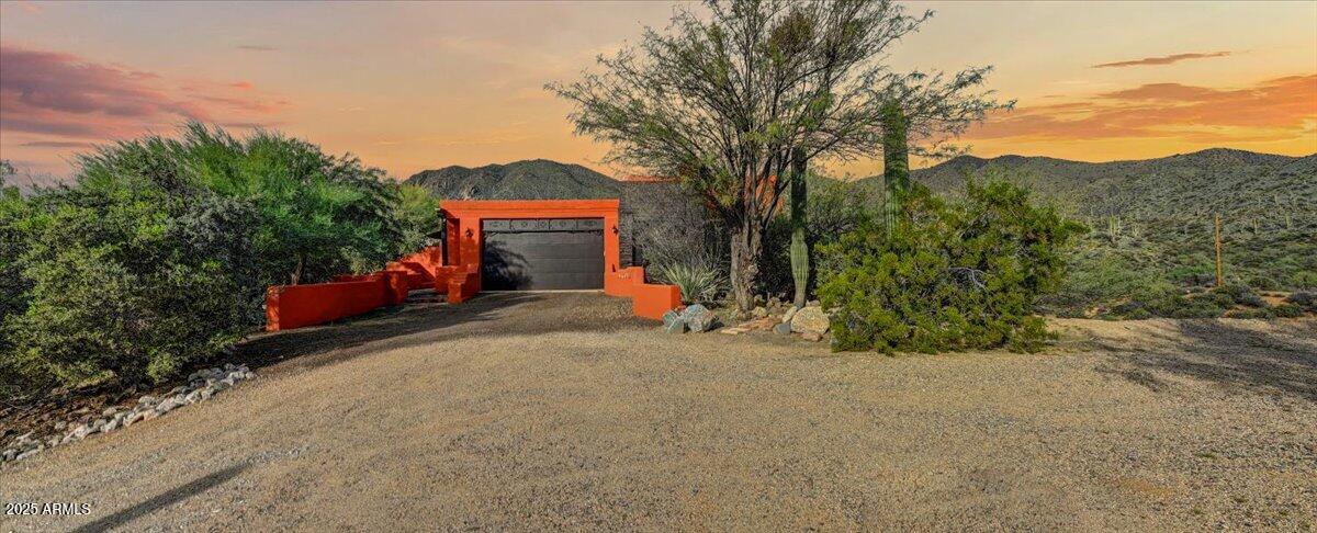 11702 East Blue Wash Road Scottsdale, AZ 85262 - Photo 41 of 50 a front view of a house with a yard and a garage