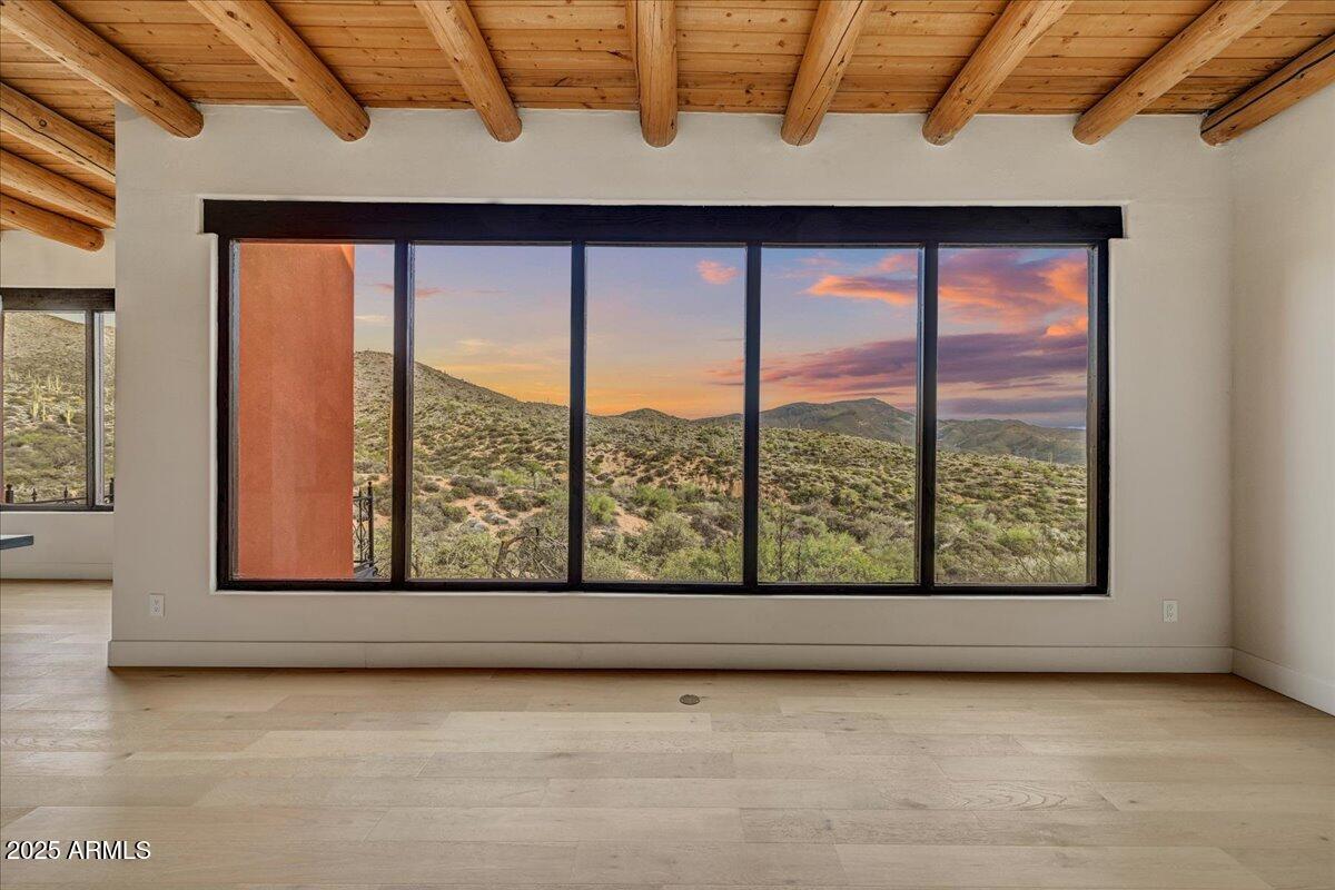 11702 East Blue Wash Road Scottsdale, AZ 85262 - Photo 9 of 50 an empty room with large windows