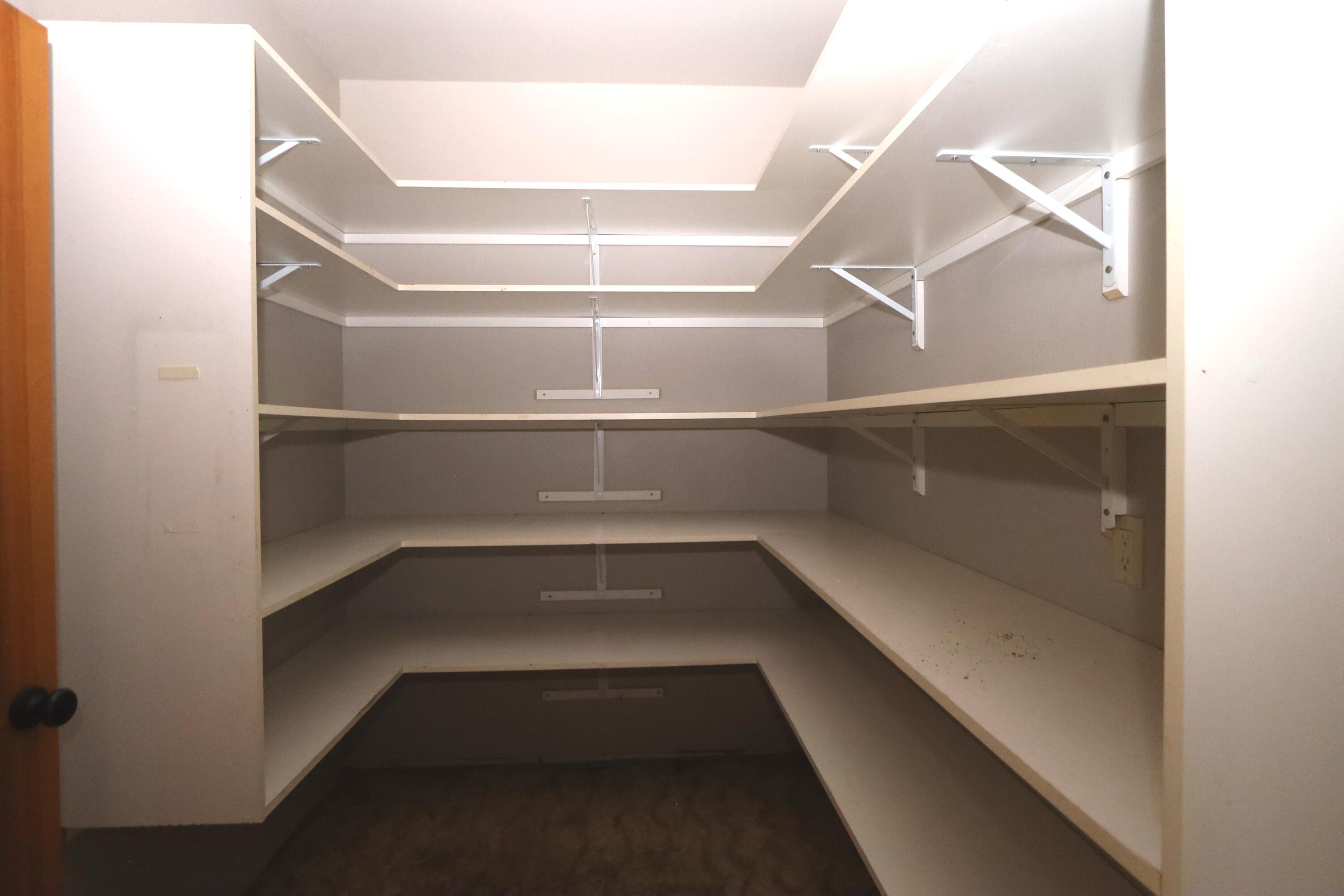 21491 Bear Creek Road Bend, OR 97701 - Photo 14 of 45 a view of store room with racks