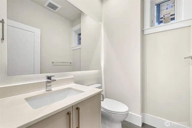 a bathroom with a sink and a toilet