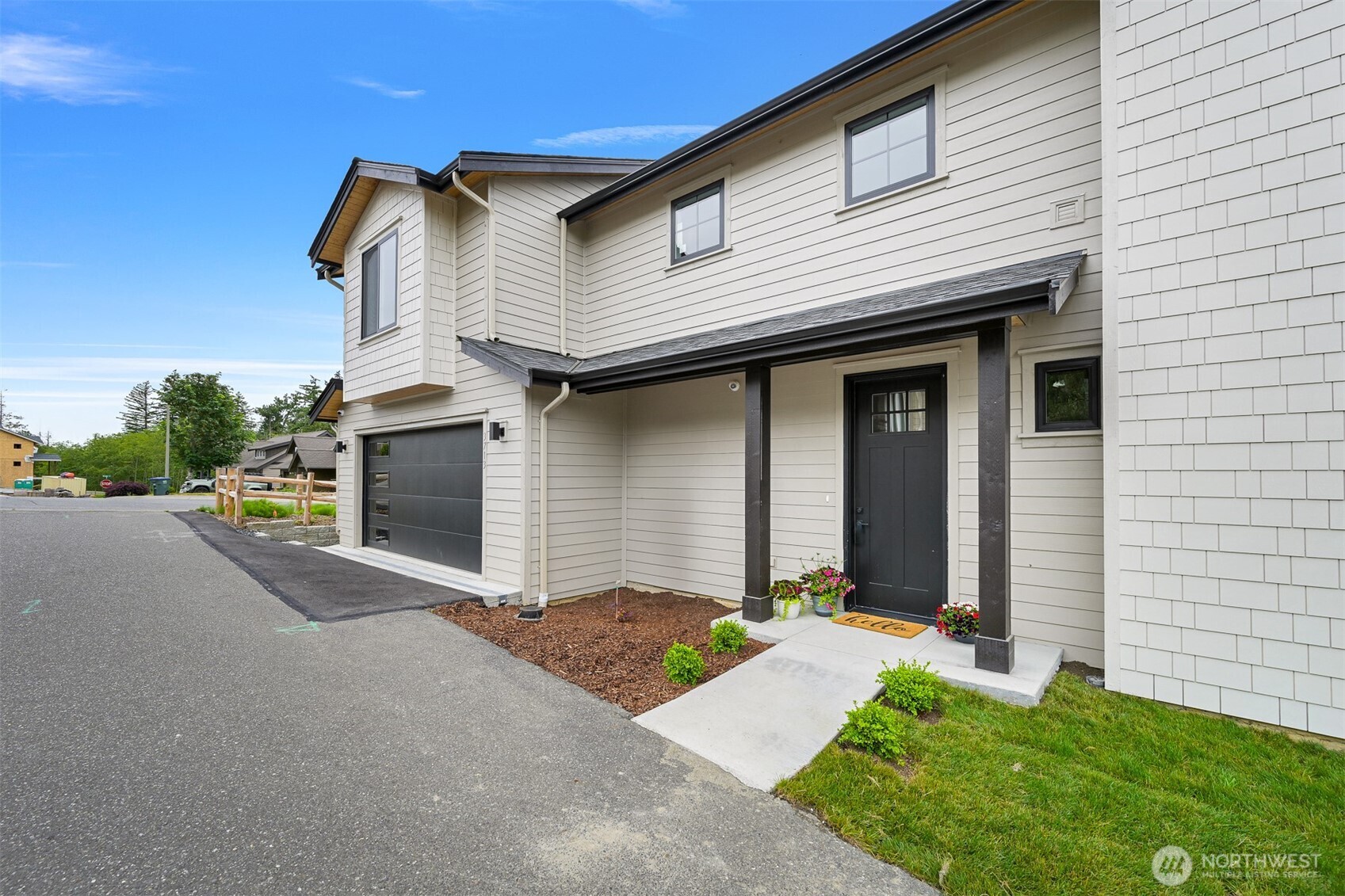 3713 Bristol Street Bellingham, WA 98226 - Photo 40 of 40 a front view of a house with a yard and garage