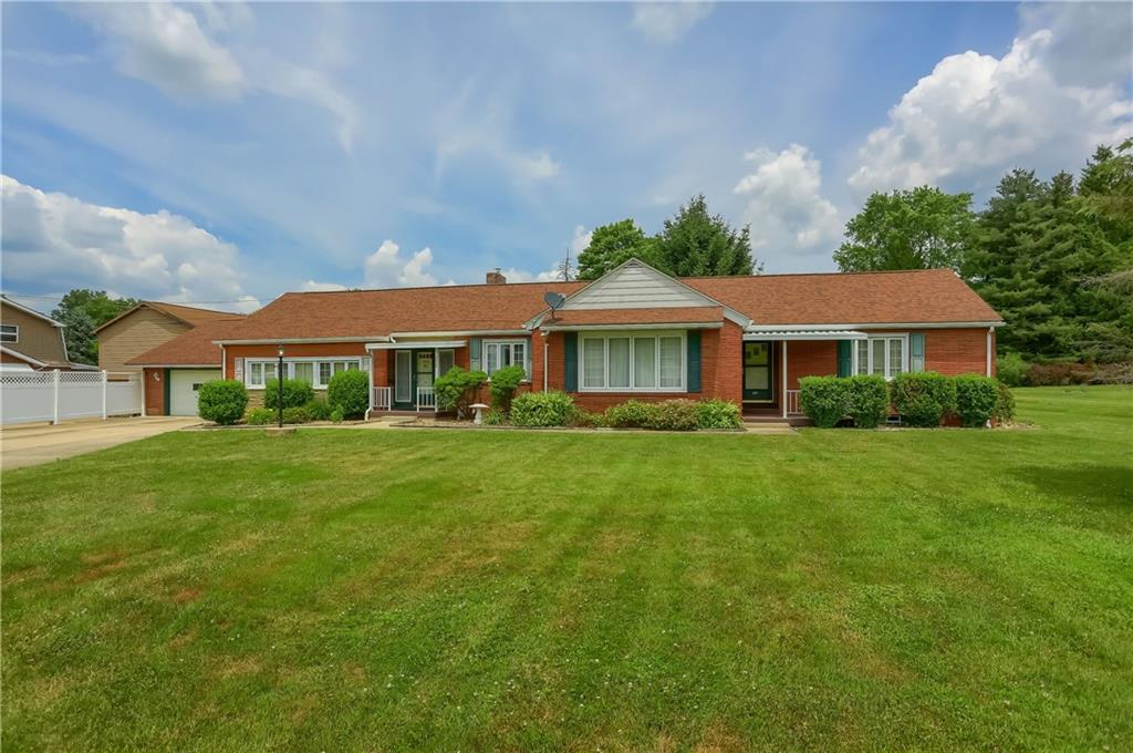 2215 Maple Drive Ford City, PA 16226 - Photo 1 of 28 a front view of a house with a garden