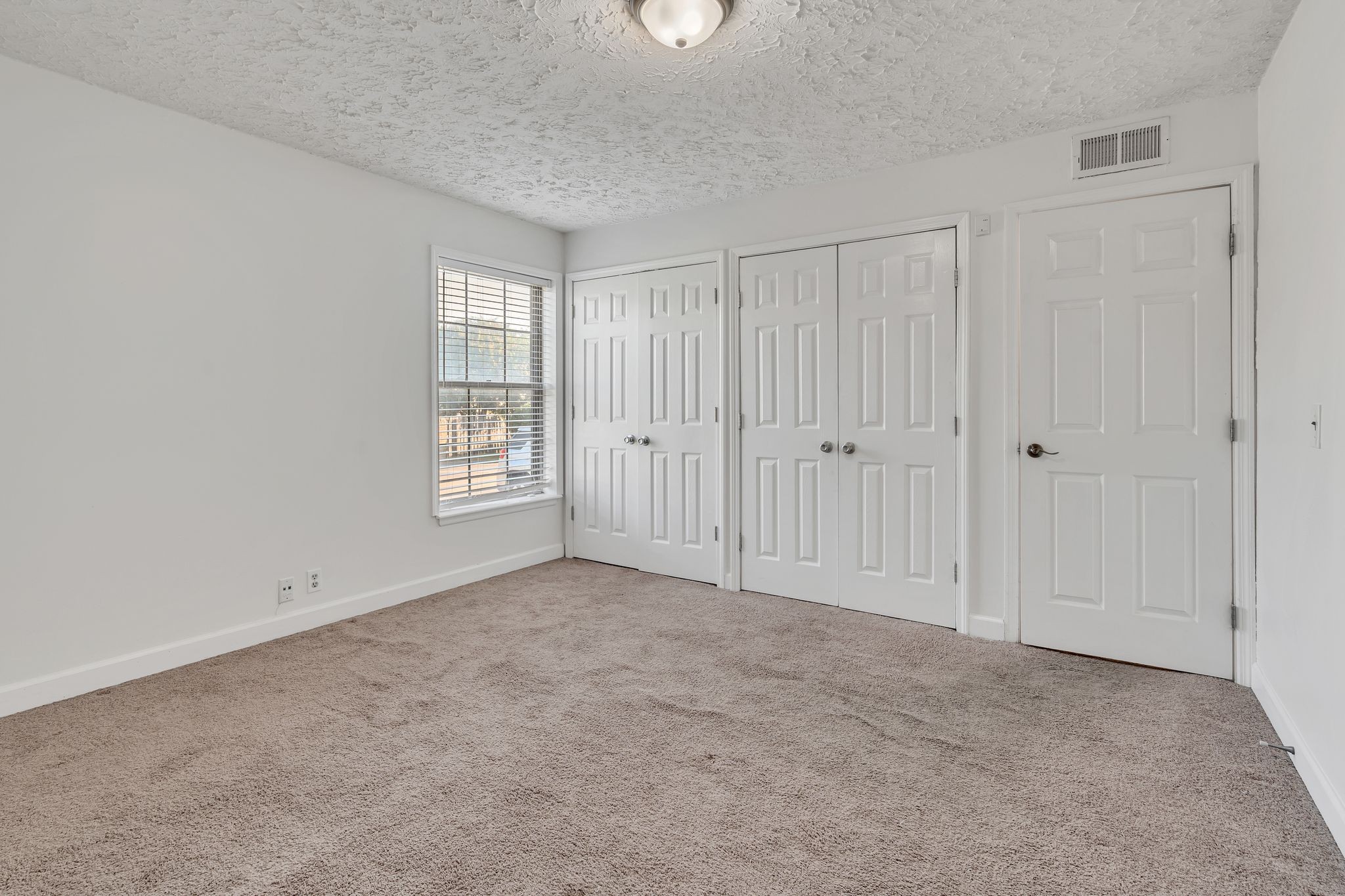 2116 Hobbs Road, Unit M16 Nashville, TN 37215 - Photo 20 of 24 a view of an empty room with a window