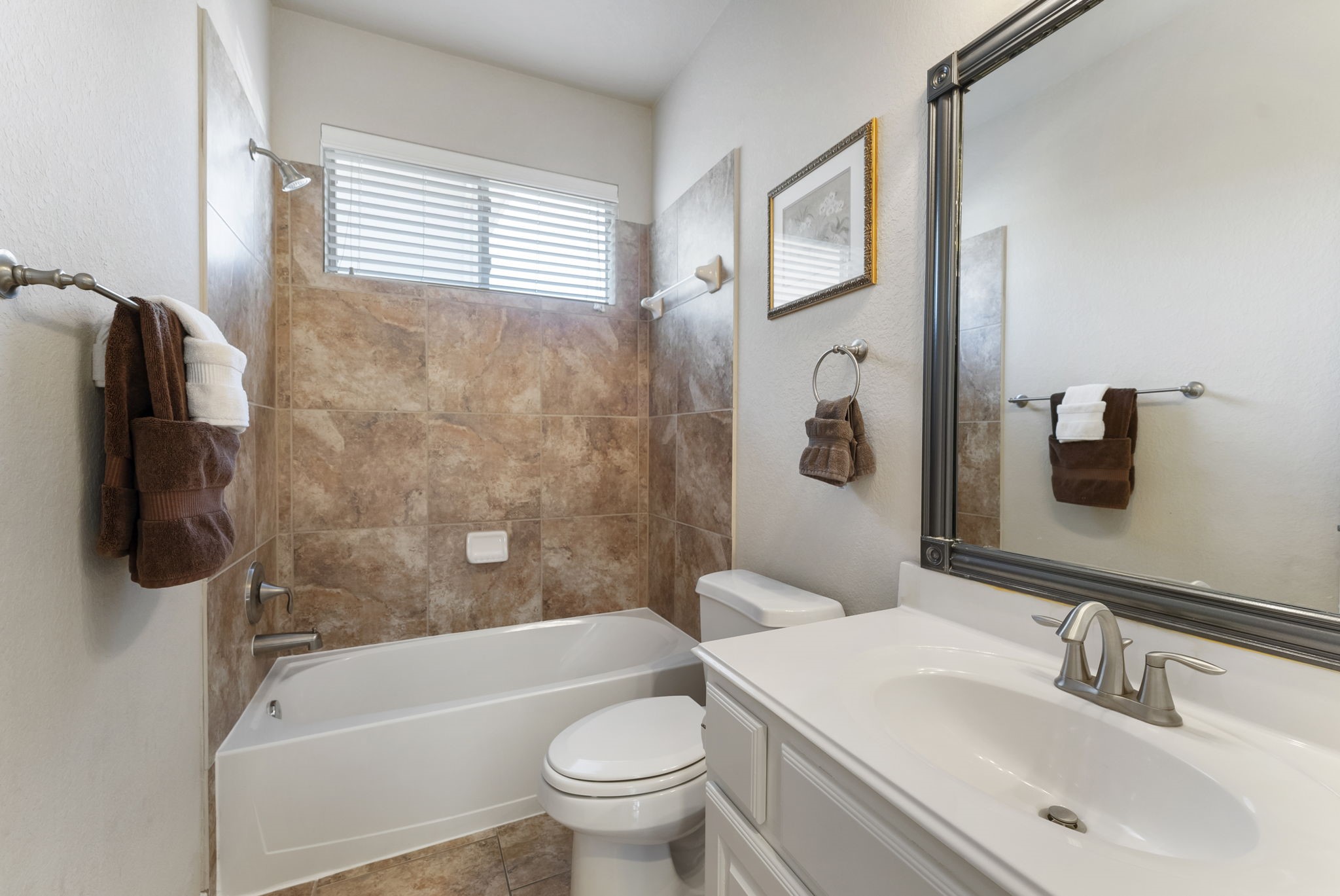 19223 Senterra Lakes Boulevard Spring, TX 77379 - Photo 11 of 48 a bathroom with a toilet a sink and bathtub