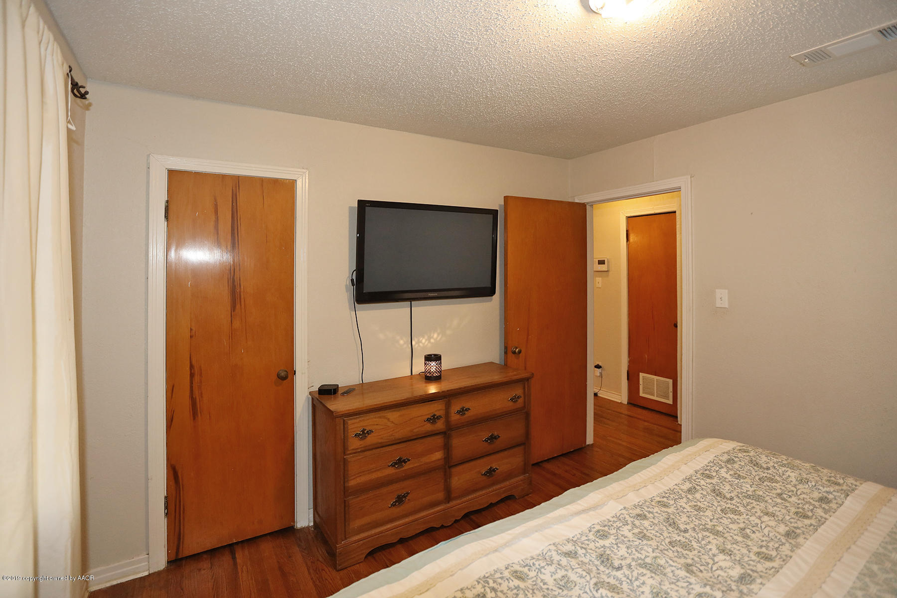 3814 South Monroe Street Amarillo, TX 79110 - Photo 11 of 22 a bedroom with a bed and a flat screen tv