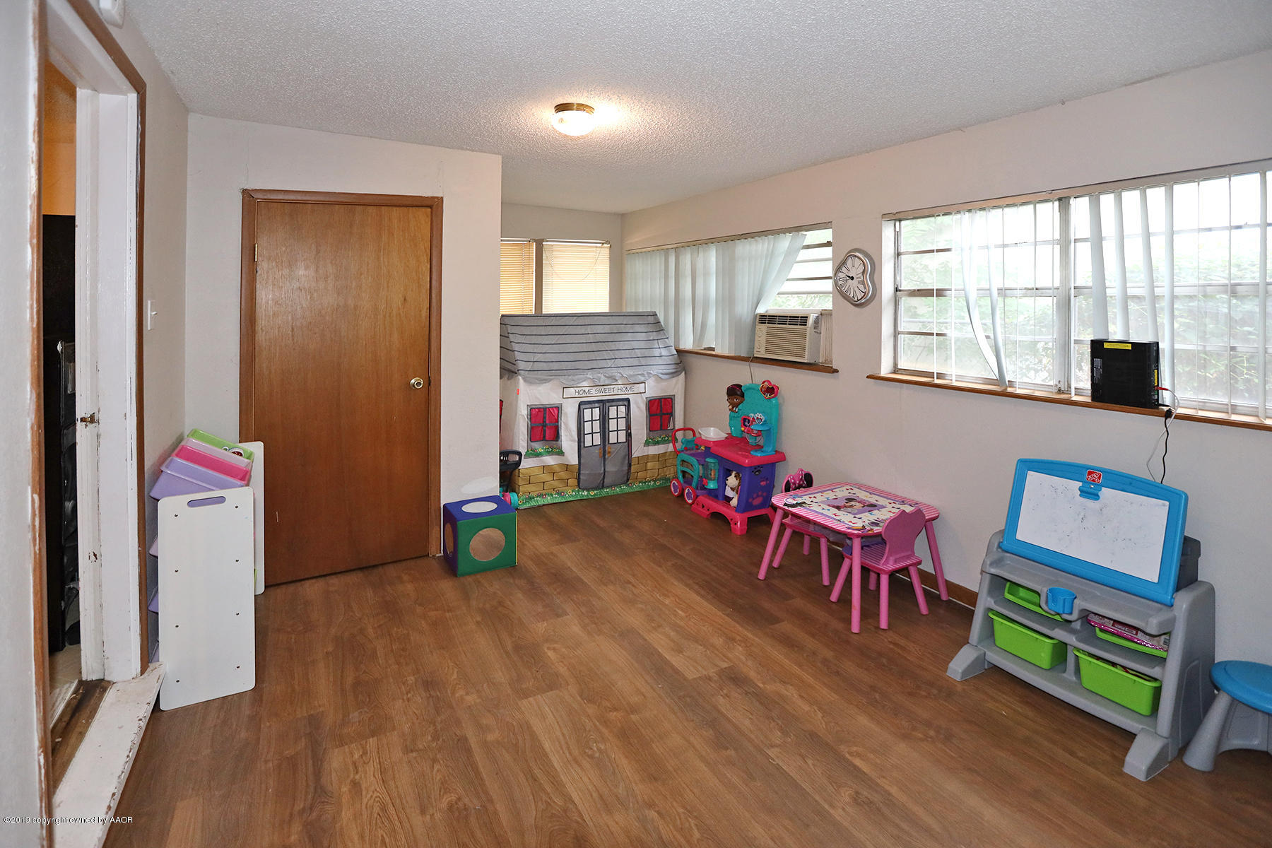 3814 South Monroe Street Amarillo, TX 79110 - Photo 14 of 22 a living room with furniture and a wooden floor