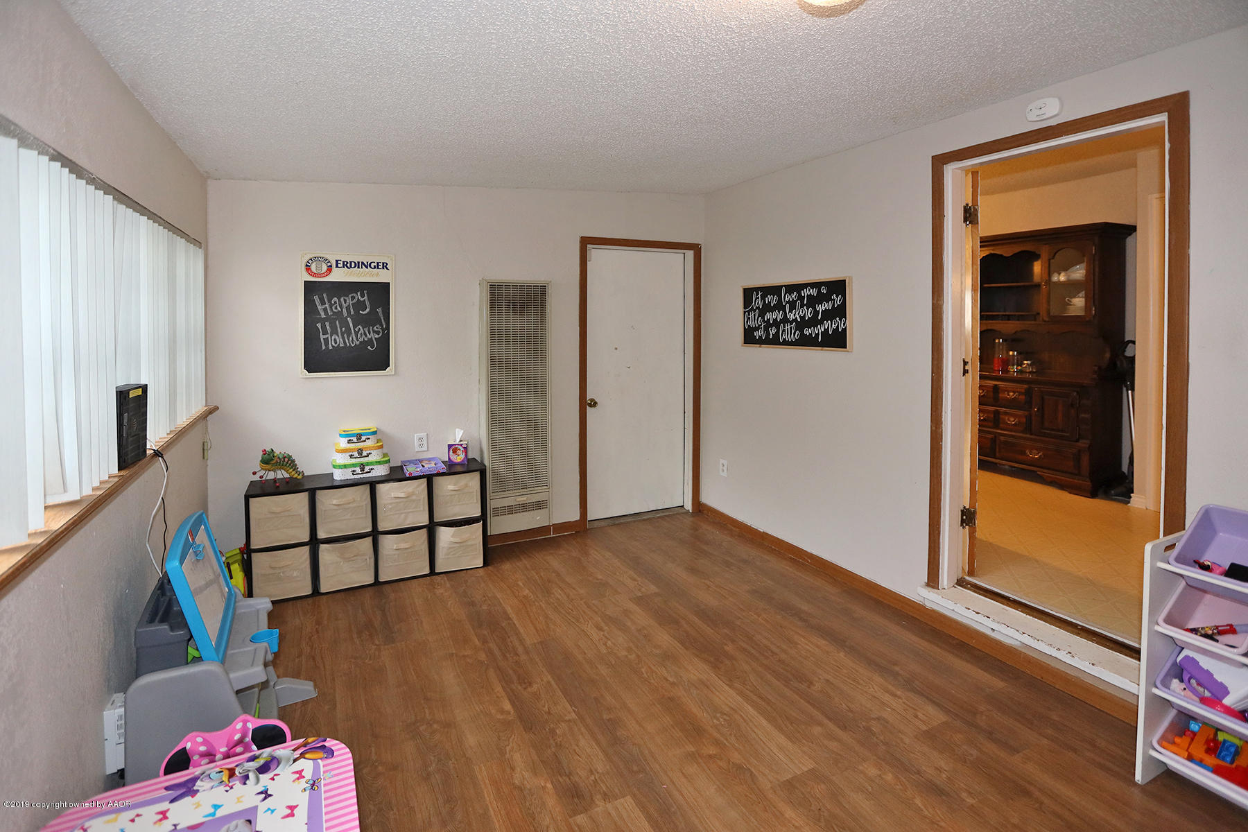 3814 South Monroe Street Amarillo, TX 79110 - Photo 15 of 22 a view of room with furniture and wooden floor