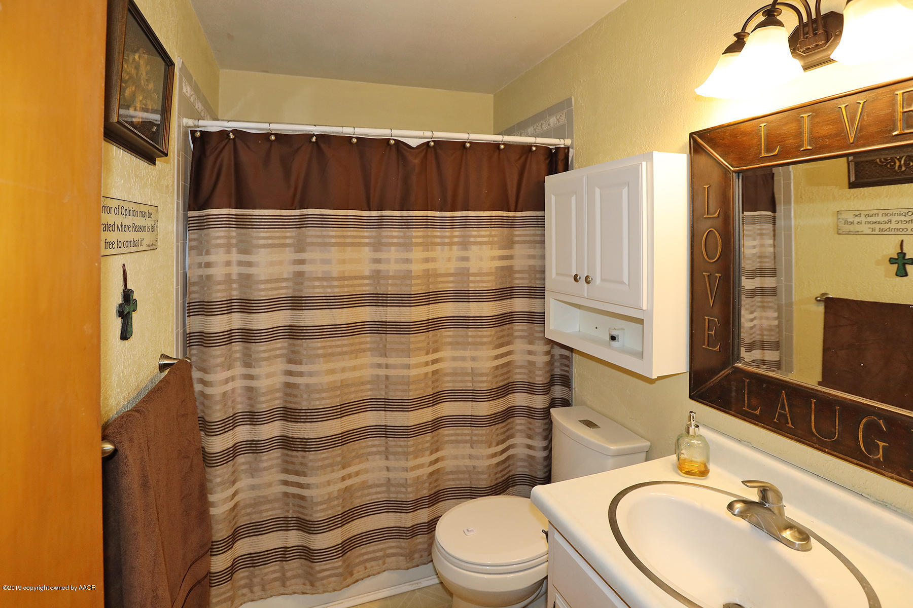 3814 South Monroe Street Amarillo, TX 79110 - Photo 16 of 22 a bathroom with a sink toilet and shower