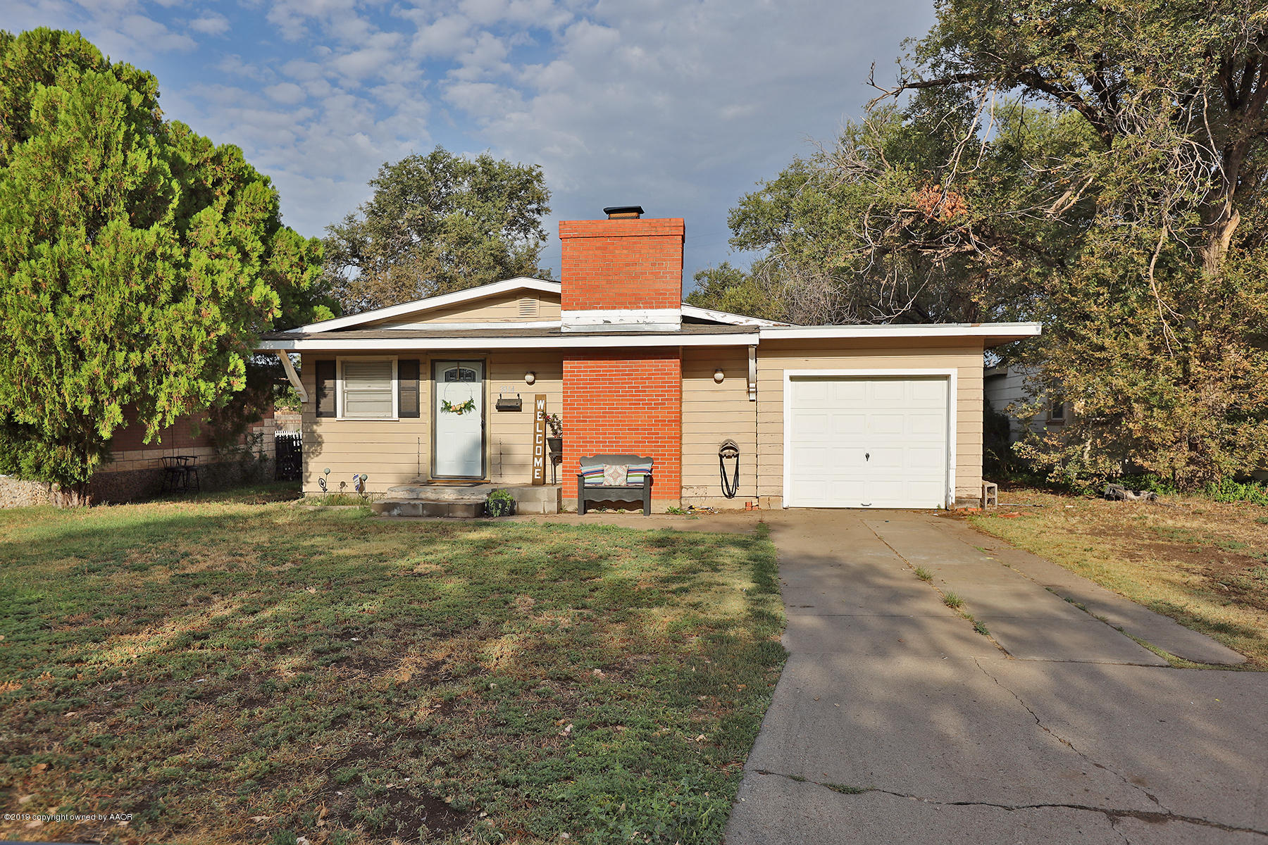 3814 South Monroe Street Amarillo, TX 79110 - Photo 20 of 22 a front view of a house with a yard and garage
