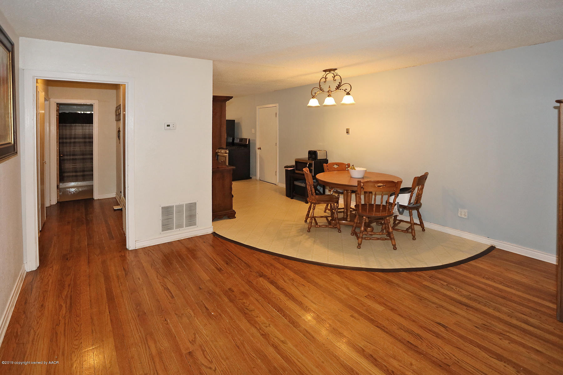 3814 South Monroe Street Amarillo, TX 79110 - Photo 5 of 22 a view of a dining room with furniture and wooden floor