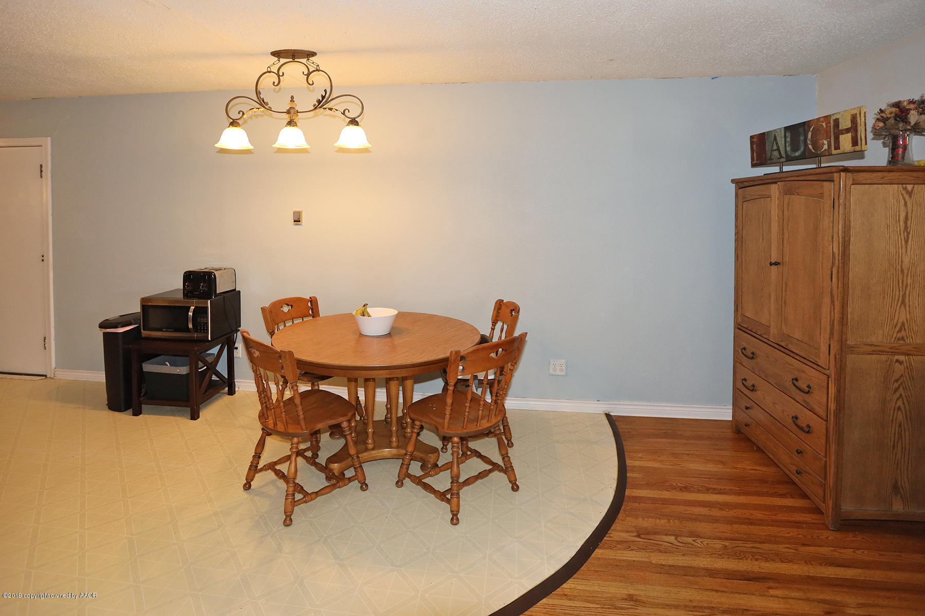 3814 South Monroe Street Amarillo, TX 79110 - Photo 6 of 22 a view of a dining room with furniture and chandelier