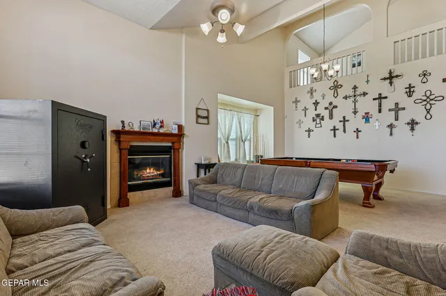 a kitchen with a dining table chairs and white appliances