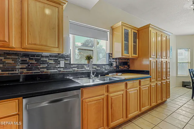 a view of a dining room with furniture and a potted plant