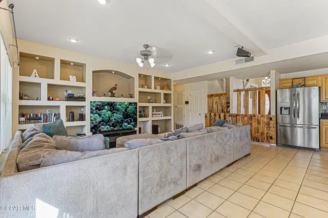 a spacious bedroom with a bed and wooden floor