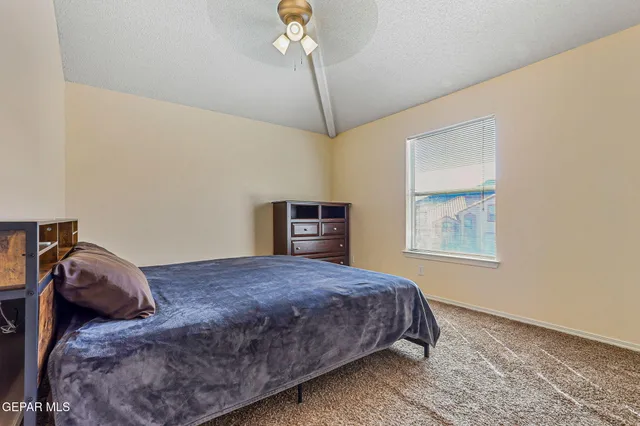 a view of a house with backyard swimming pool and sitting area