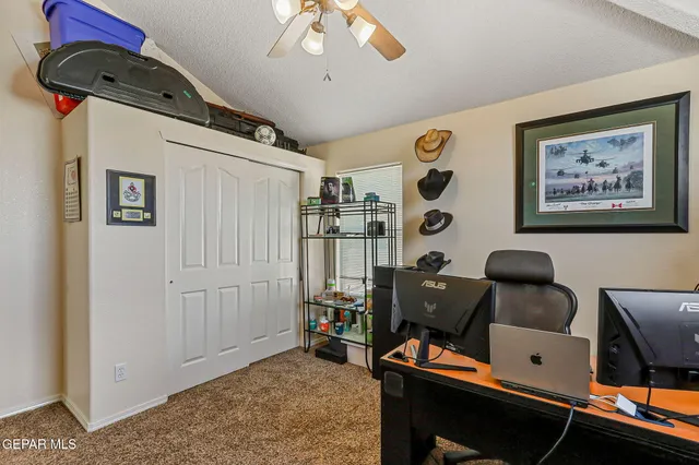 a view of a house with swimming pool and sitting area