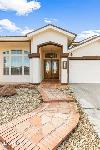 a living room with furniture a table and a large window