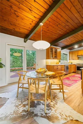 a view of a dining room with furniture window and outside view