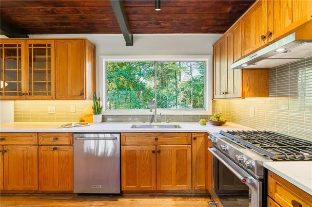 a view of a glass door with a yard