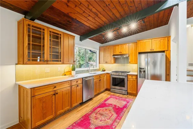 a spacious bedroom with a bed and a table in it