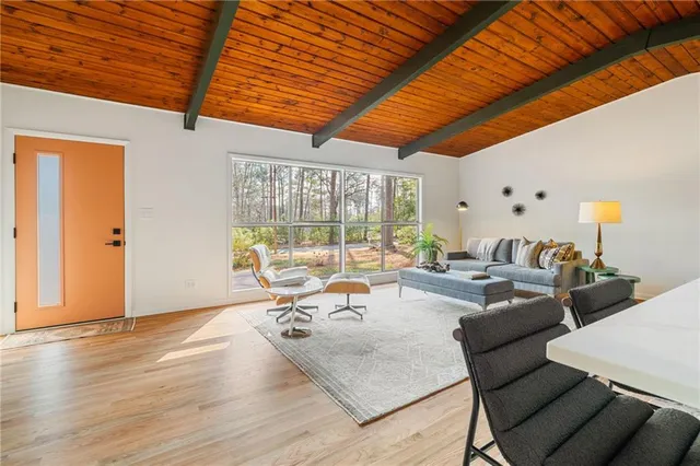 a living room filled with furniture and a table
