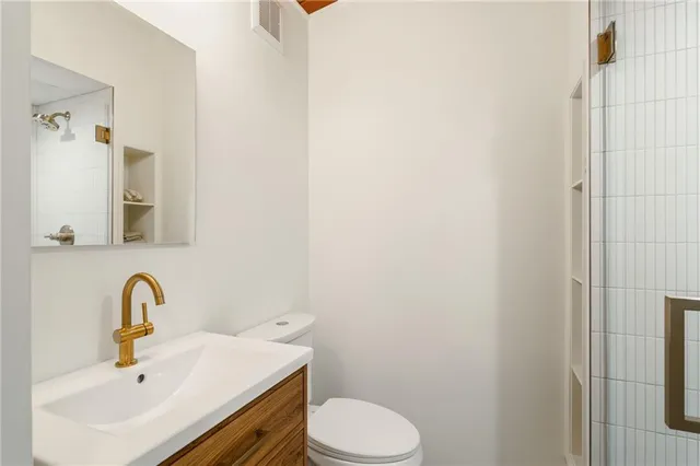 a view of a dining room with furniture and a window