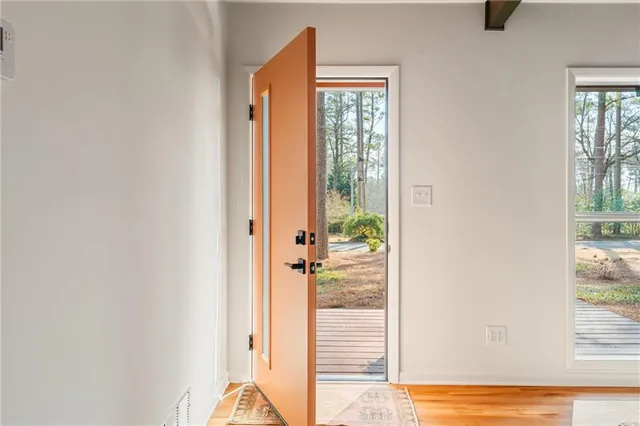 a view of balcony with wooden floor