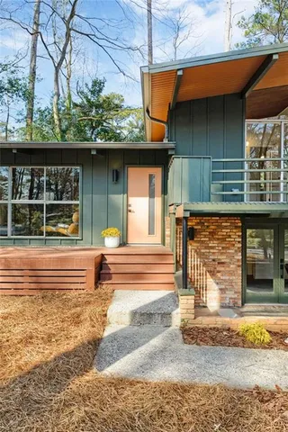 a view of a backyard with sitting area