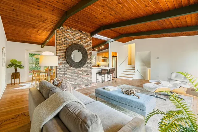 a living room with furniture and a lamp