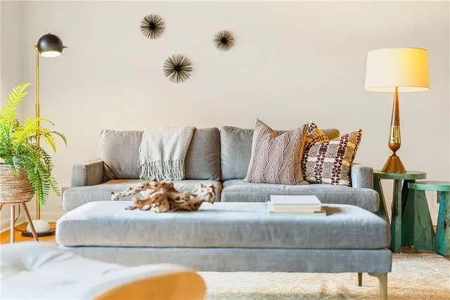 a dining room with furniture and a chandelier