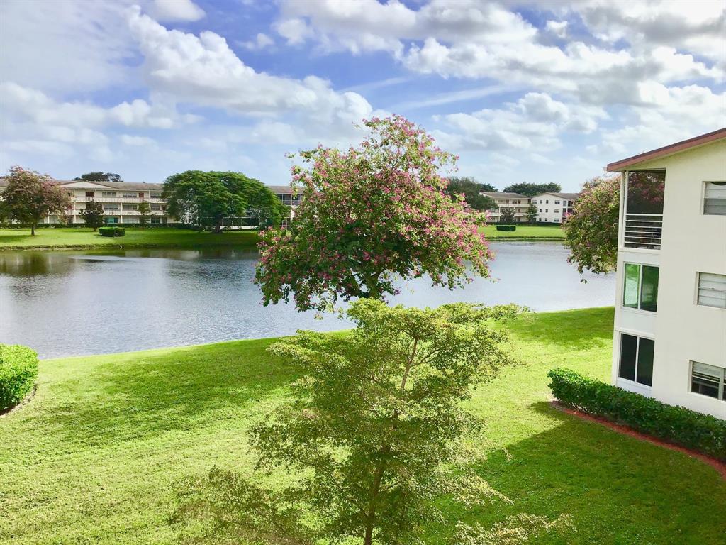 35 Suffolk Way, Unit 35 Boca Raton, FL 33434 - Photo 17 of 20 a view of a lake with a big yard