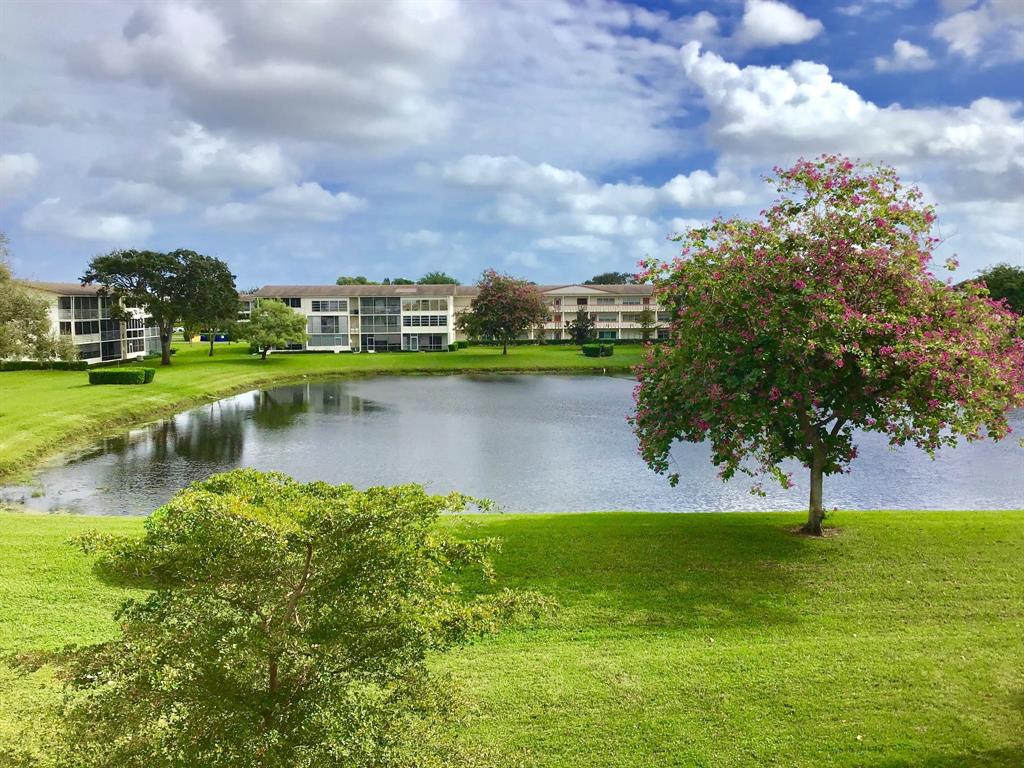 35 Suffolk Way, Unit 35 Boca Raton, FL 33434 - Photo 18 of 20 a view of a lake with a big yard