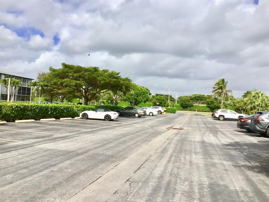 35 Suffolk Way, Unit 35 Boca Raton, FL 33434 - Photo 19 of 20 a view of a street with a building in the background