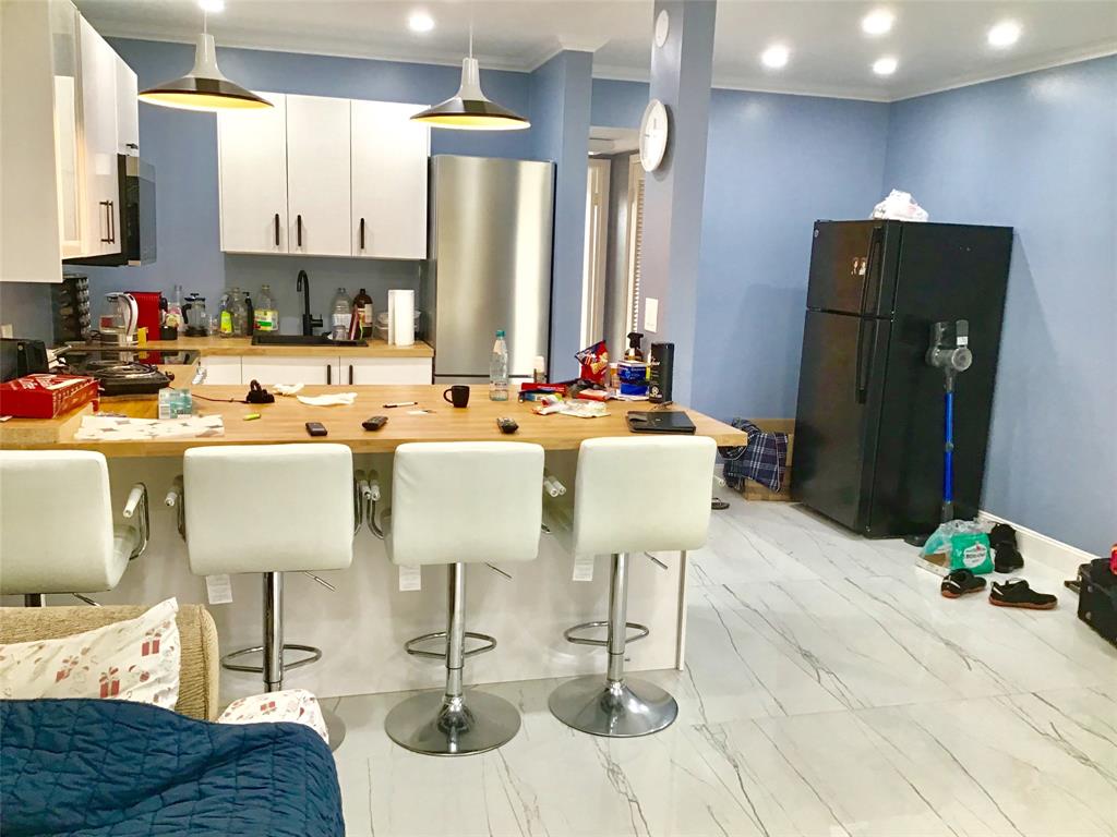 35 Suffolk Way, Unit 35 Boca Raton, FL 33434 - Photo 2 of 20 a view of kitchen with stainless steel appliances kitchen island granite countertop dining room and chairs