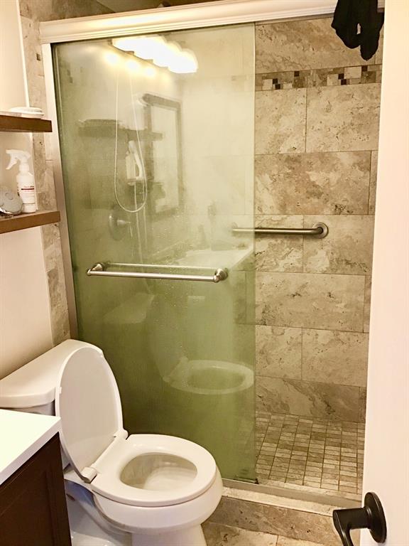35 Suffolk Way, Unit 35 Boca Raton, FL 33434 - Photo 9 of 20 a bathroom with a toilet and a shower