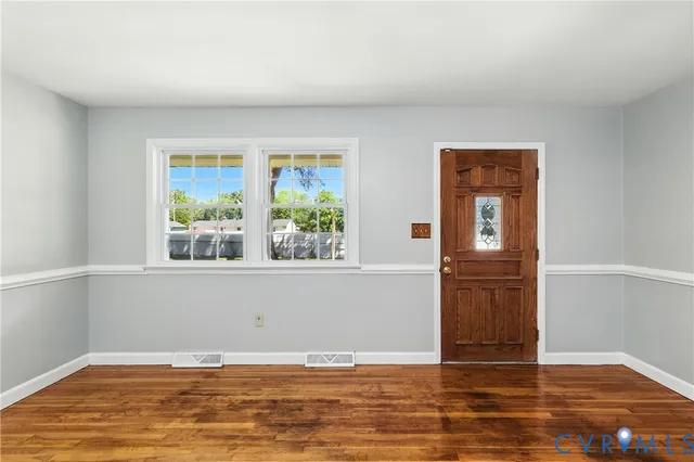a view of wooden floor and cabinet in a room