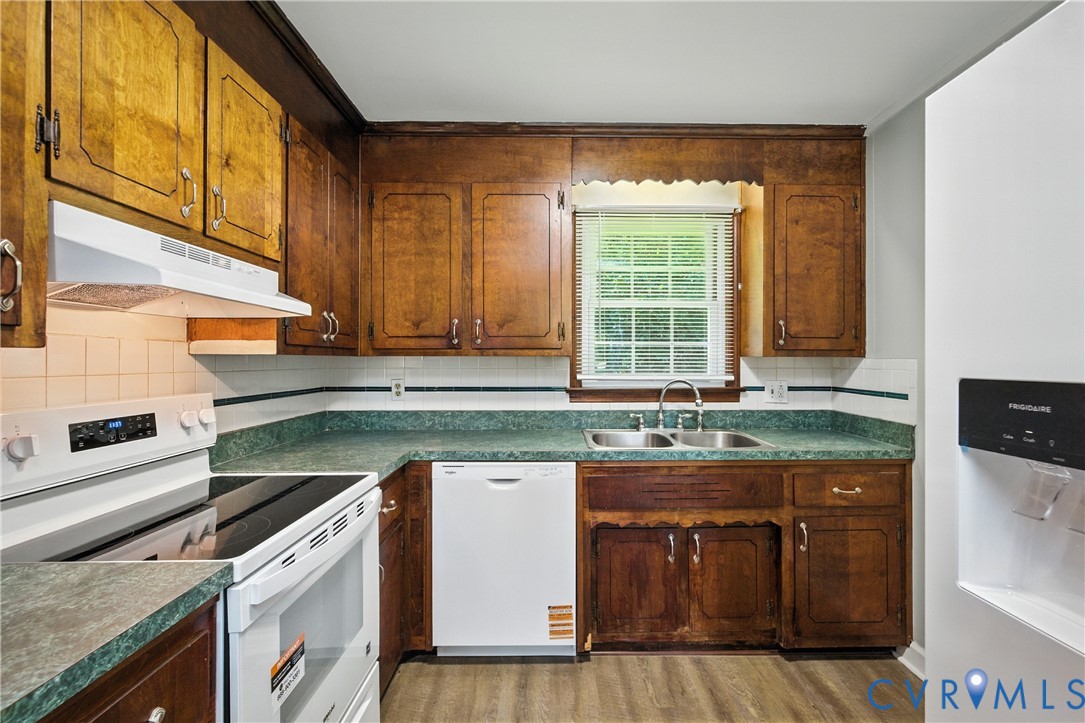 2111 Clary Road Petersburg, VA 23805 - Photo 19 of 47 a kitchen with a sink stove and cabinets